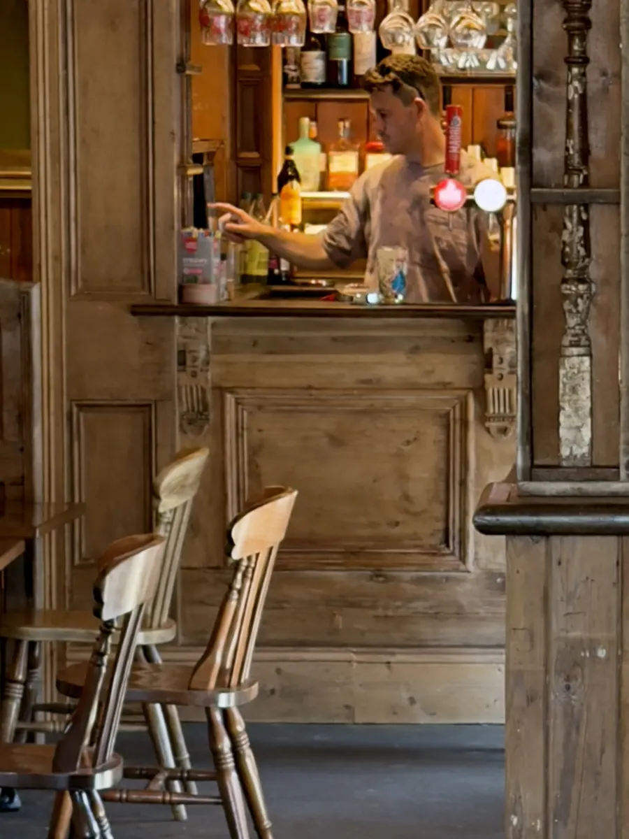 Drinks being prepared at the serving hatch